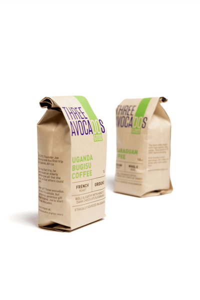 Two brown bags of coffee on a white backdrop